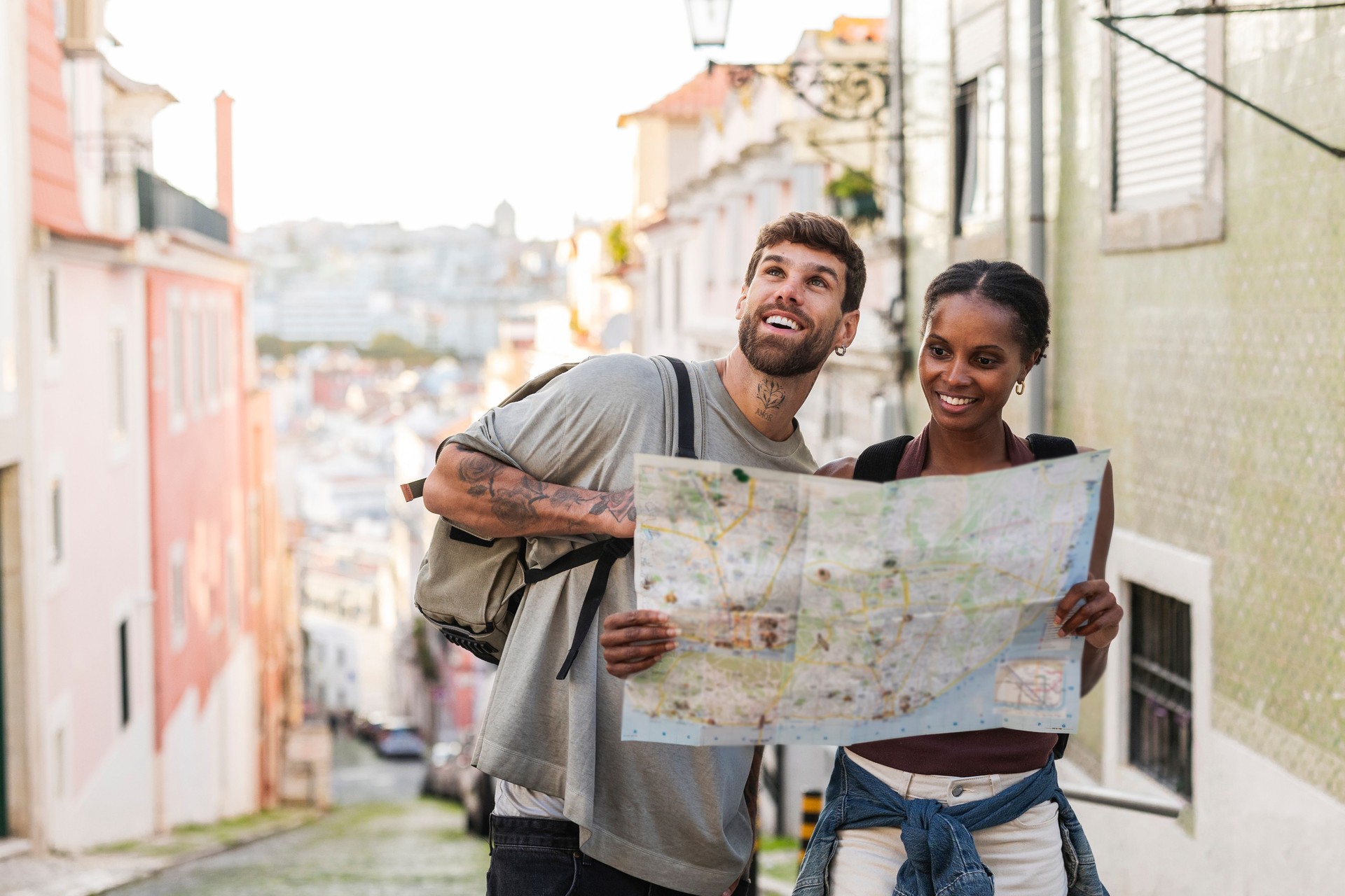Tourists consulting a map in the charming streets of lisbon, portugal
